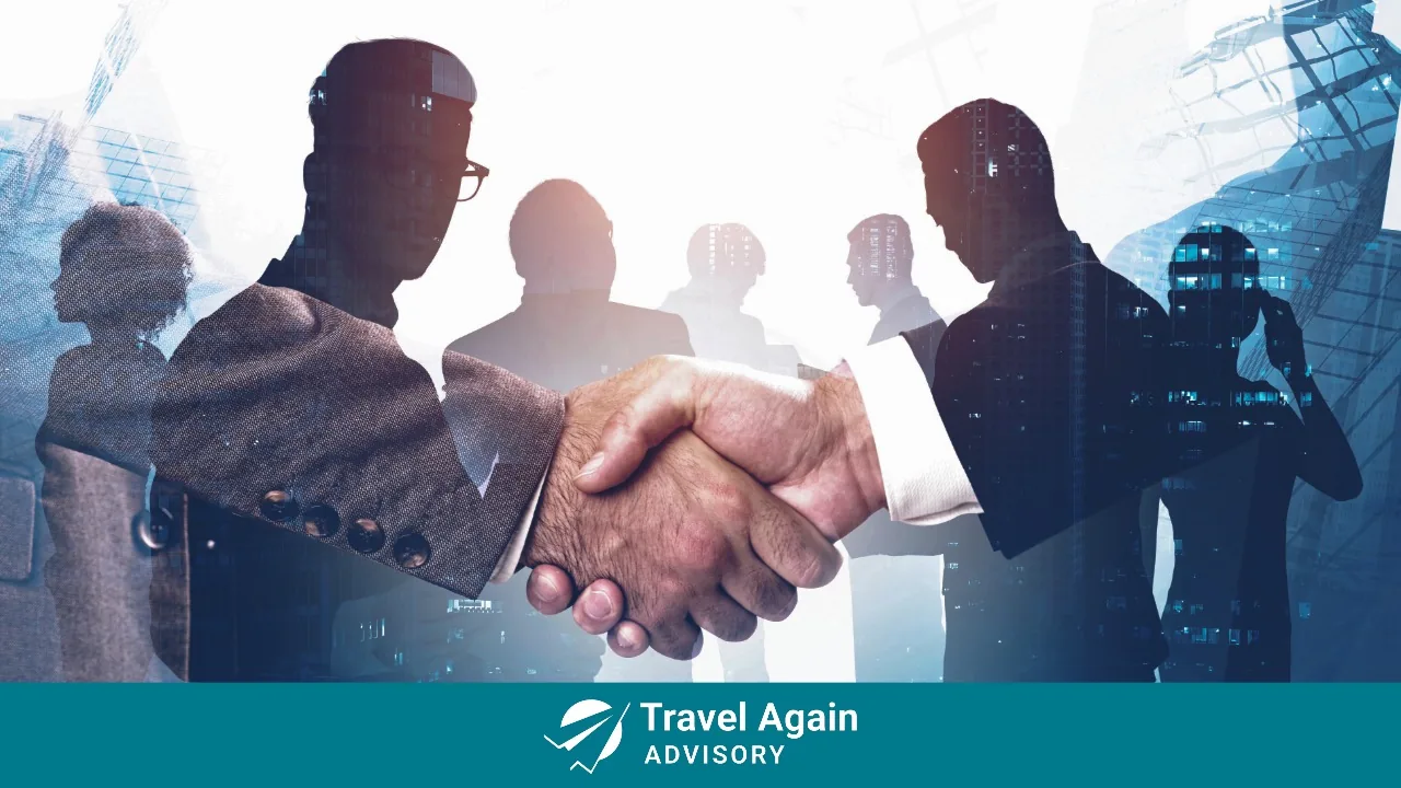 A handshake that indicates a successful corporate sale.