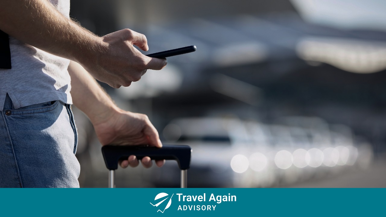 A man looking for information using travel media on his phone.